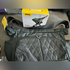 Brand new, Doona attachment, diaper bag, and Doona sunshade extension never used